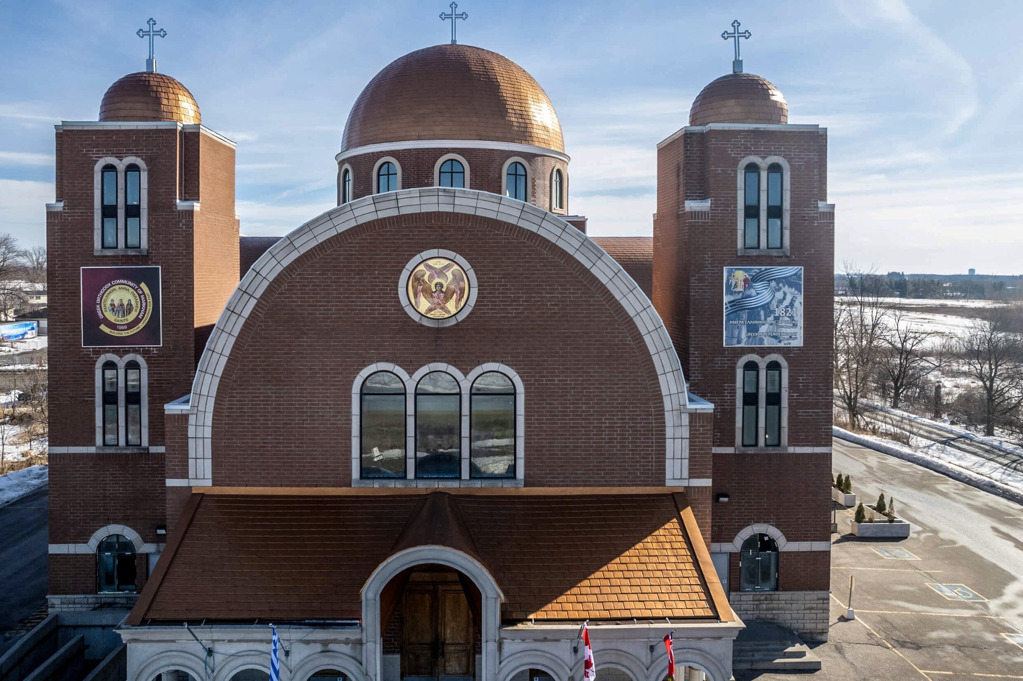Aerial view of Greek Orthodox Church showing full building and copper domes